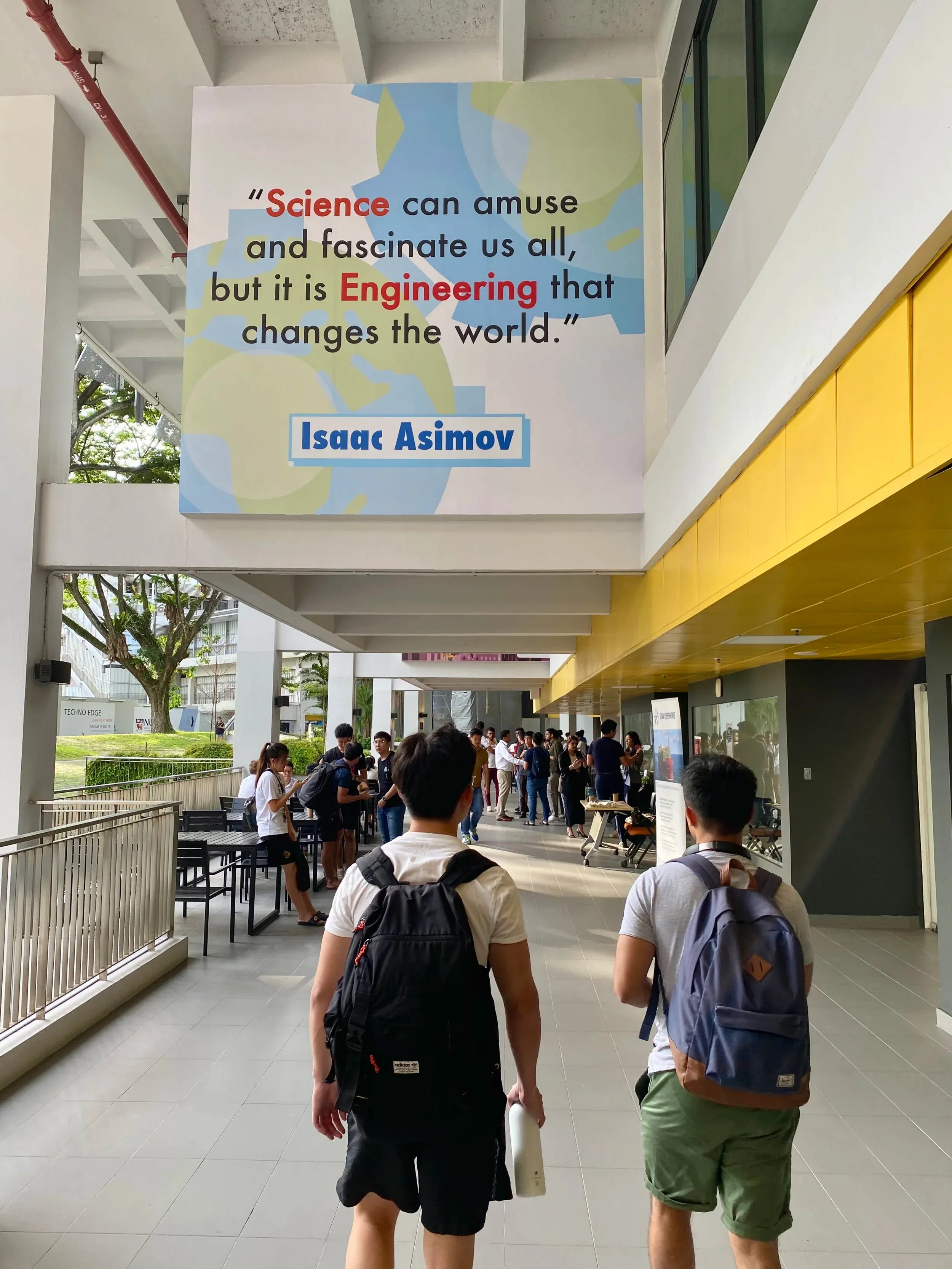 Zihan and Adrian reading the science smack talk on the engineering buildings.